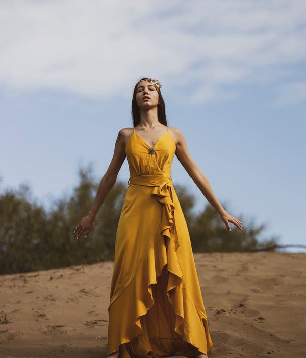 Woman in a graceful yoga pose, exuding calm and poise.